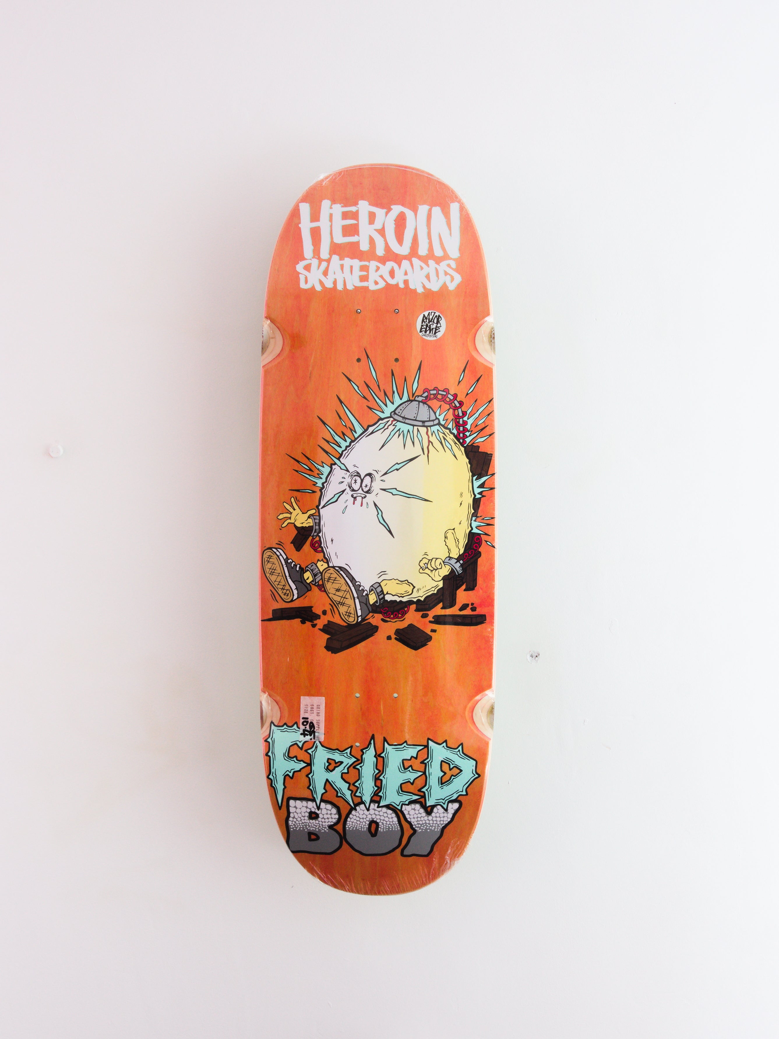 Heroin skateboards - ’fried boy’ skateboard deck - 10.40 x 32.25 14.25 orange