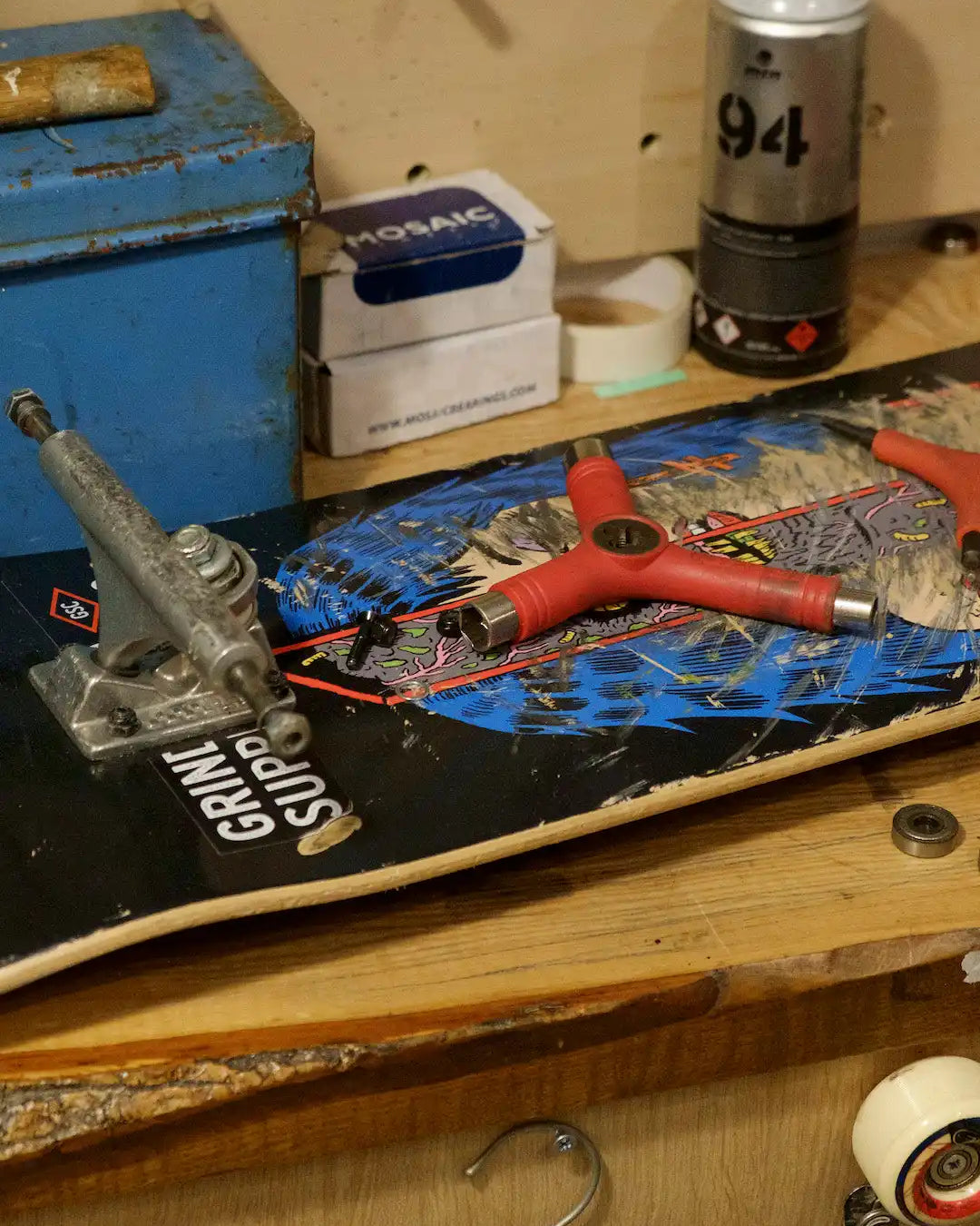 Skateboard with colorful graphic artwork and visible trucks.