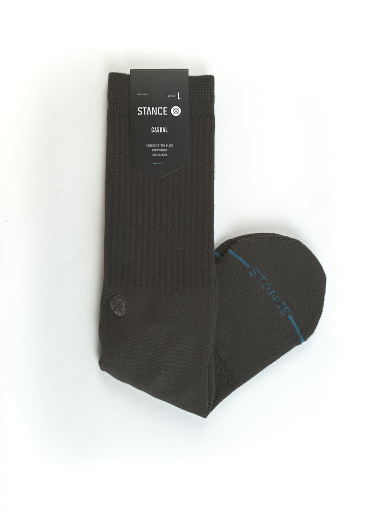 Black sock with blue stitching along the side.