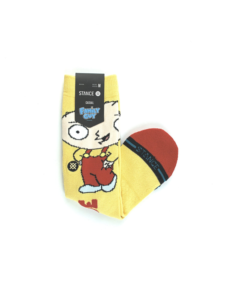 Colorful cartoon character-themed sock with a yellow background.