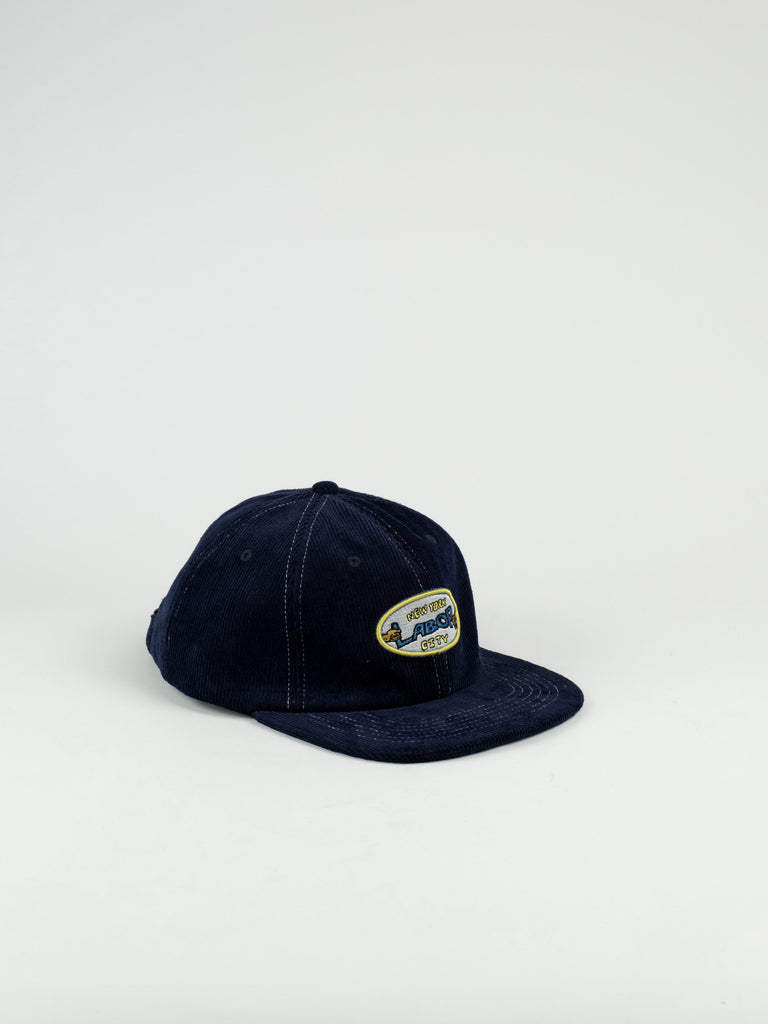 Navy blue baseball cap with oval patch from Labor Skateshop Pullman Cap, Navy Cord