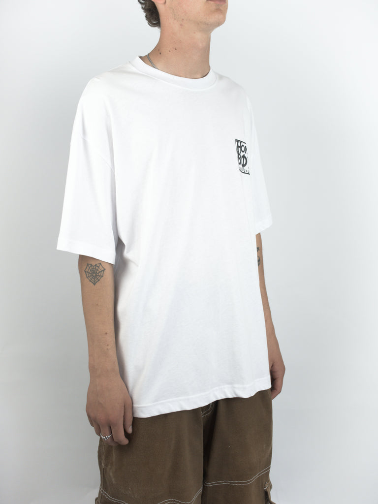 White oversized t-shirt with a small graphic on the chest.