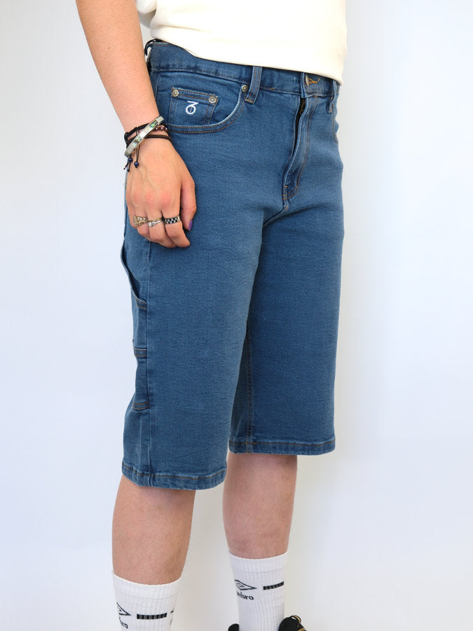 Blue denim knee-length shorts with pockets.