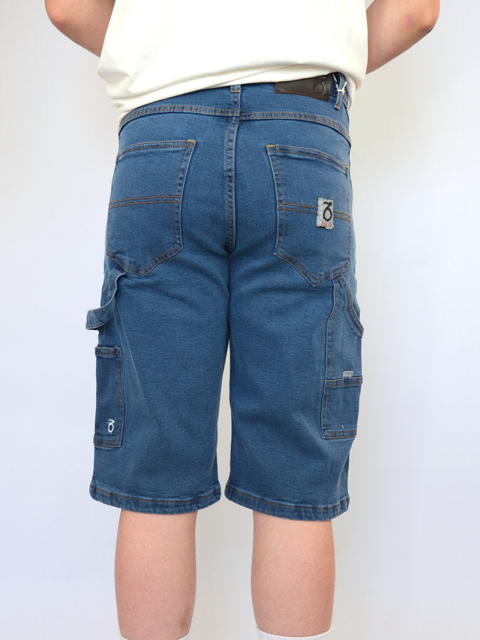 Blue denim cargo shorts with multiple pockets and a visible brand logo on the back pocket.