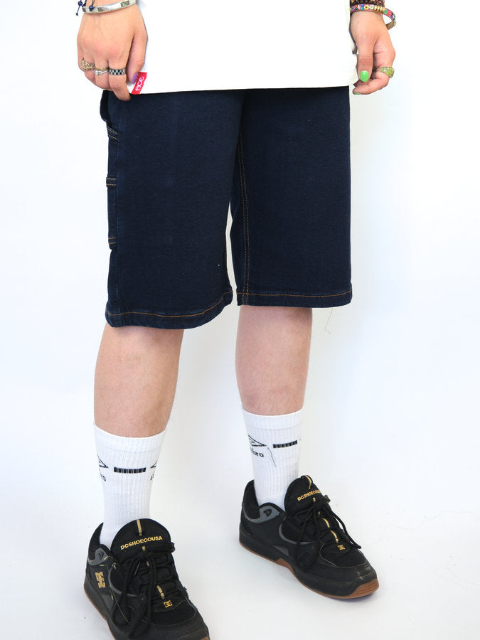 Navy blue knee-length shorts worn by a person.