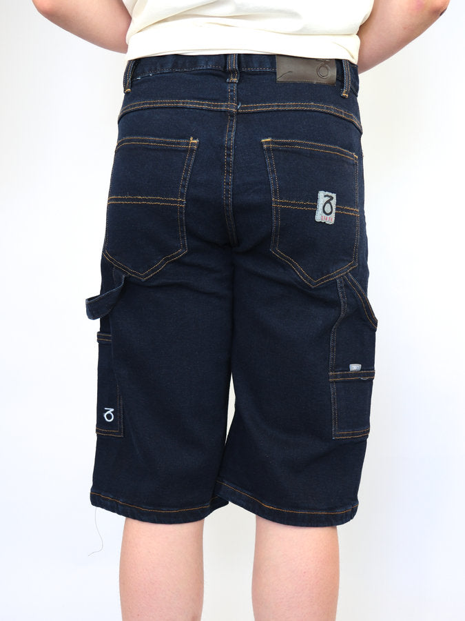 Dark blue denim cargo shorts with multiple pockets and a visible brand label.