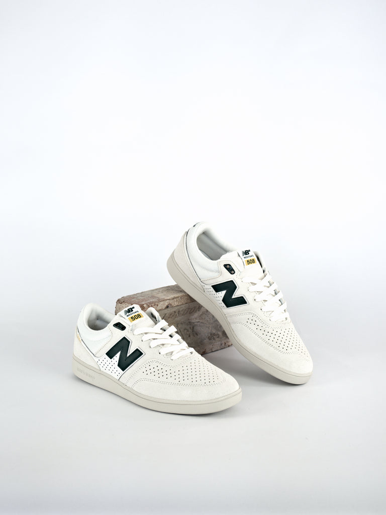 Pair of white New Balance Numeric Brandon Westgate 508’s with green logos in Forest Green