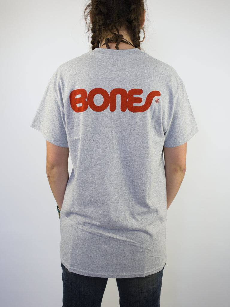 Gray t-shirt with ’BONES’ printed in red on the back.