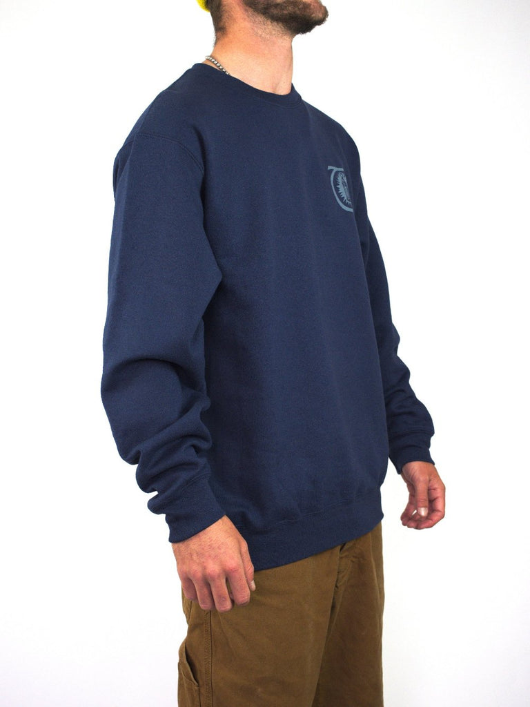 Navy blue crewneck sweatshirt with a small logo on the chest.