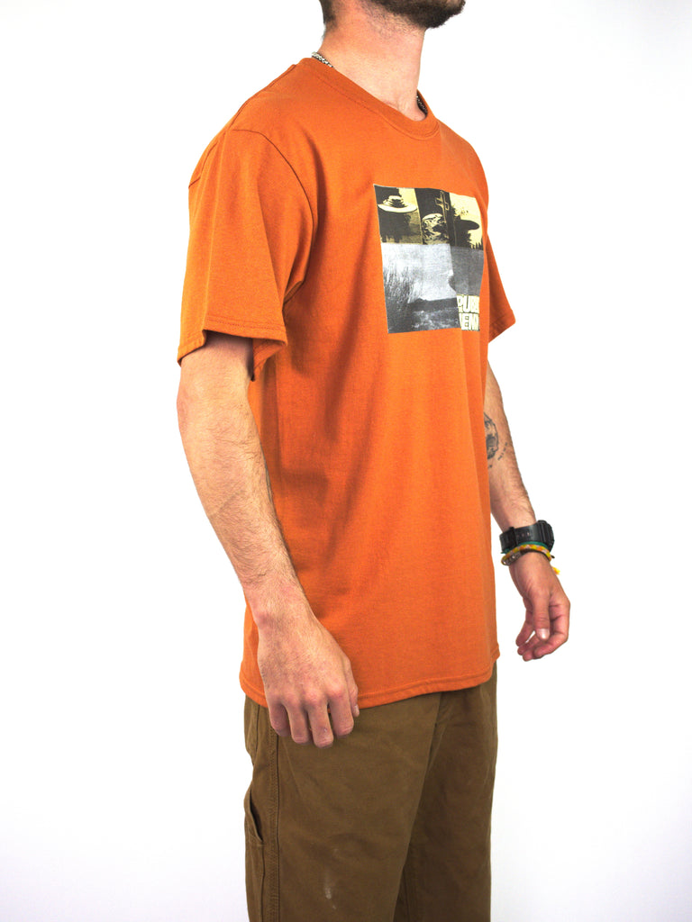 Orange Theories Of Atlantis Public Enemy T Shirt featuring a graphic print in Texas Orange