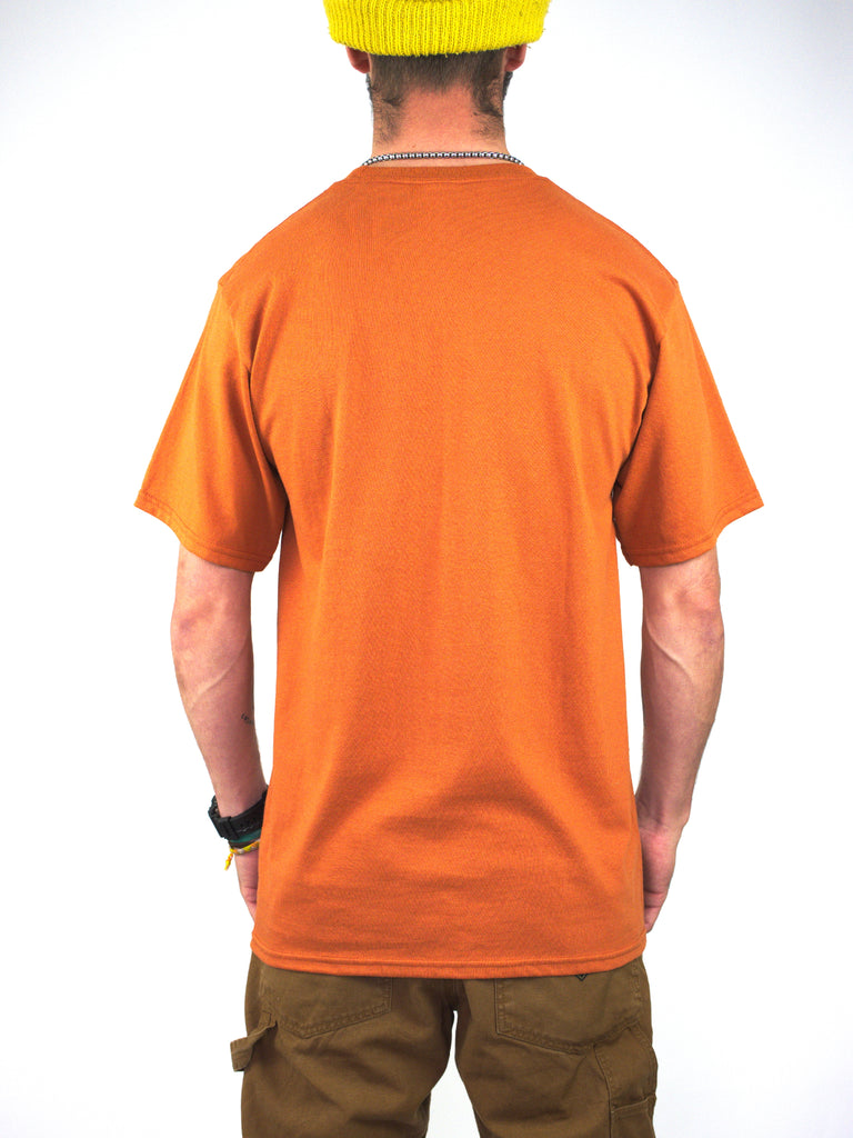 Person wearing a bright Texas Orange Public Enemy tee featuring Atlantis design