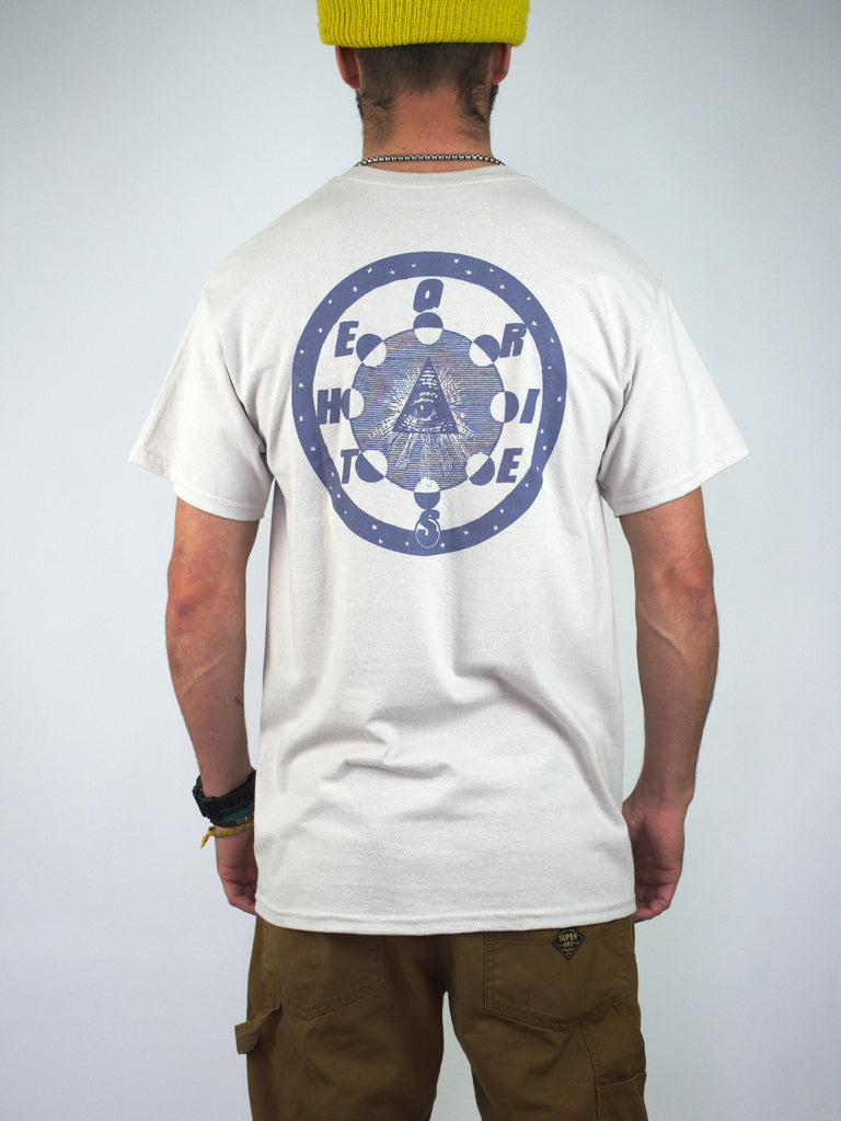 White t-shirt with a circular blue graphic design on the back.