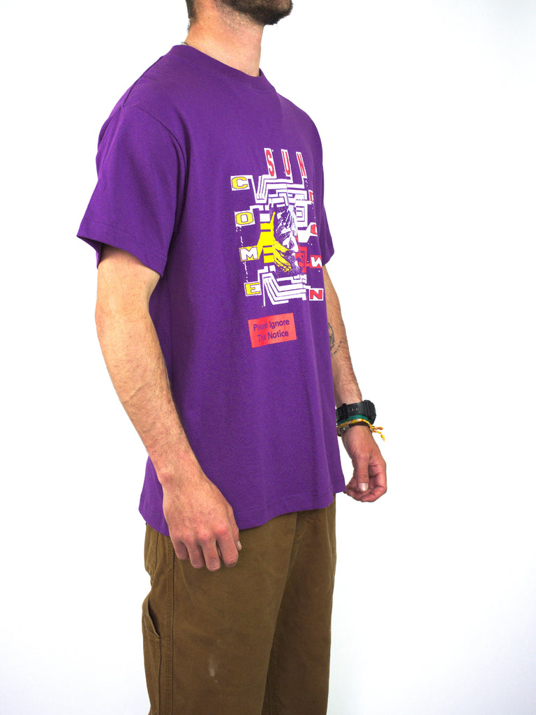 Purple t-shirt with colorful graphic design on the front.