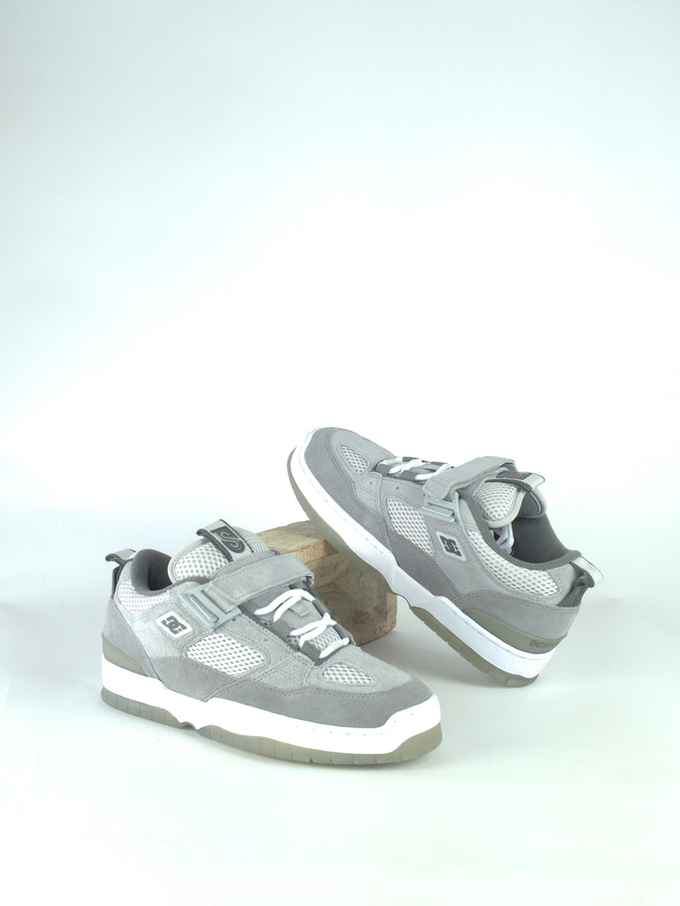 Pair of gray and white toddler sneakers with velcro straps.