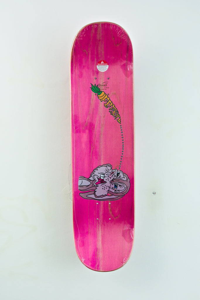 Bright pink Snack Skateboards Buns Skateboard Deck featuring green lizard and metallic skull