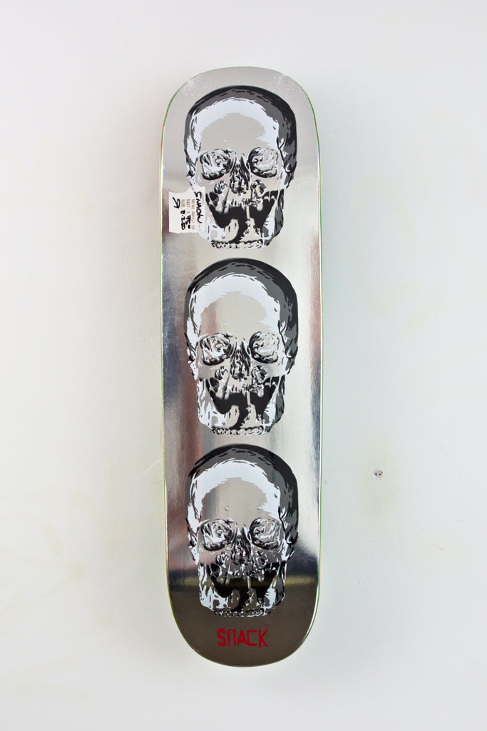 Snack Skateboards Bonesaw Skateboard Deck with black and white skull designs