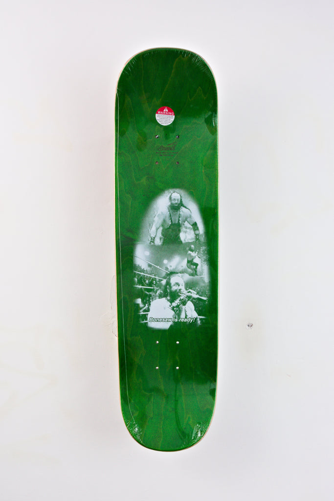 Green Snack Skateboards Bonesaw skateboard deck featuring a black and white image underneath