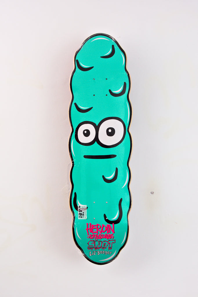 Cartoon-style turquoise pickle with wide eyes on Heroin Skateboards Lil Booger Deck