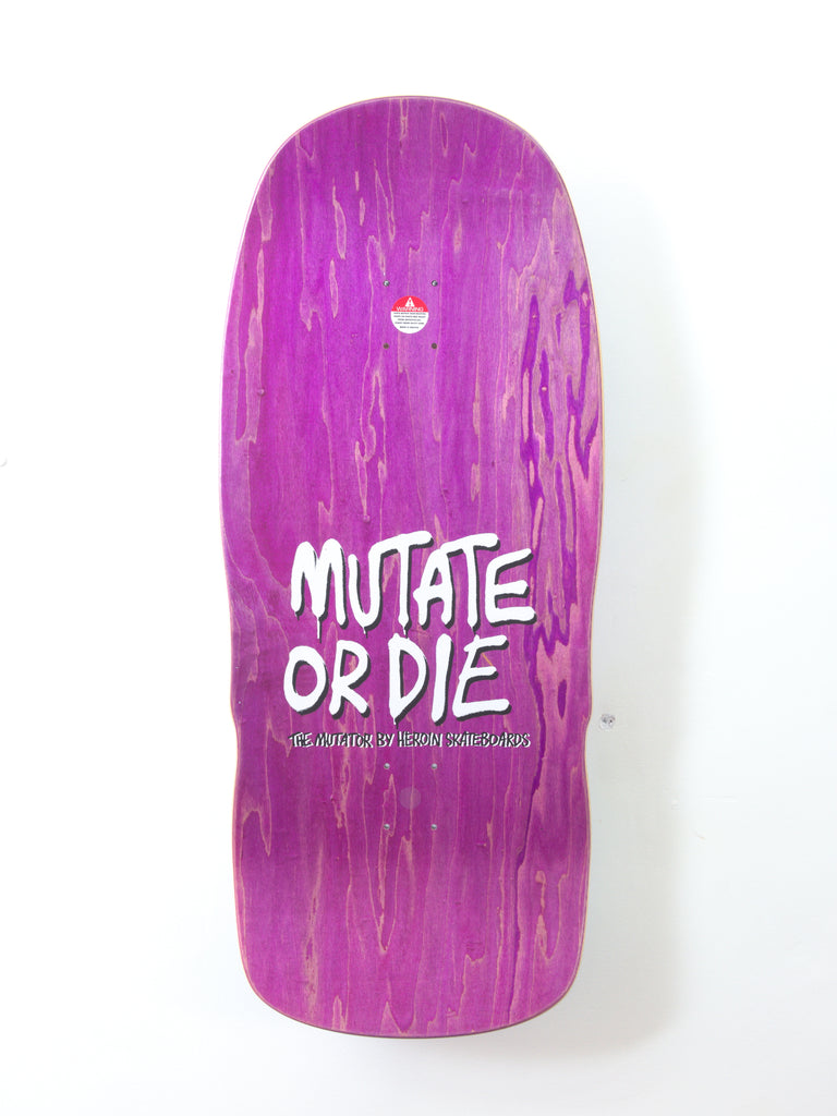 Purple skateboard deck with white text reading ’MUTATE OR DIE’.