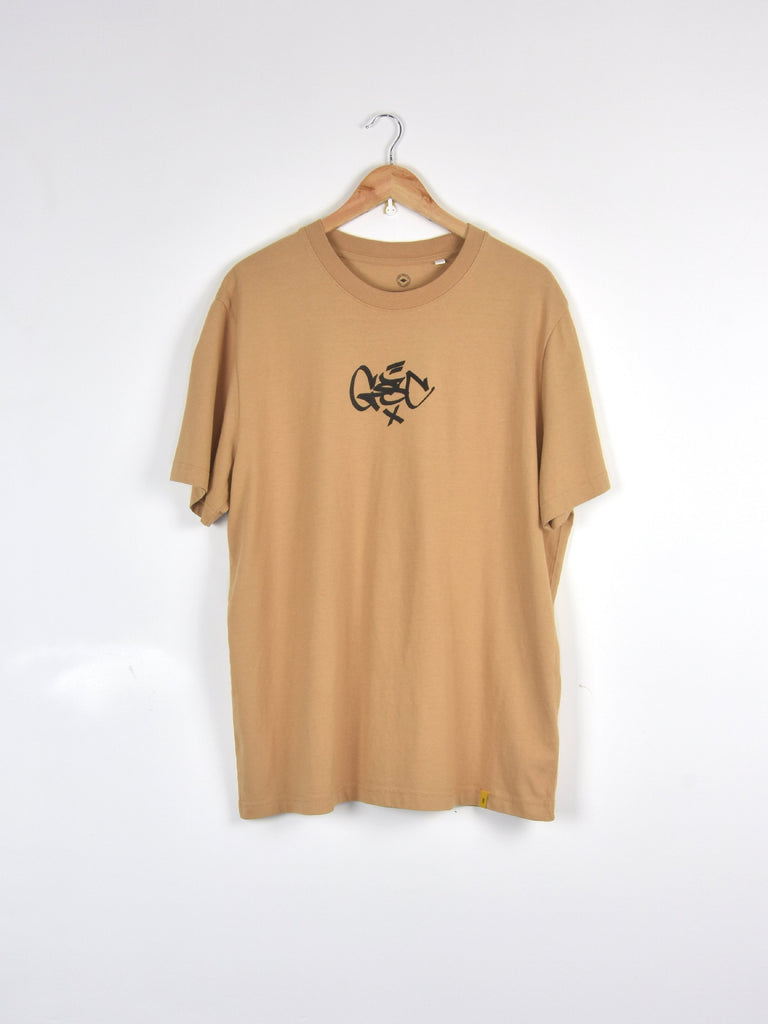 Tan t-shirt with a small black graphic design on the front.