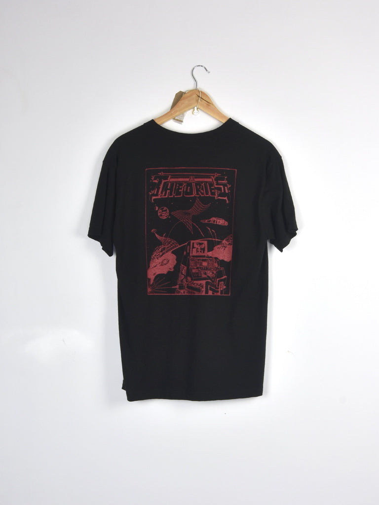 Black t-shirt with red graphic artwork hanging on a wooden hanger.