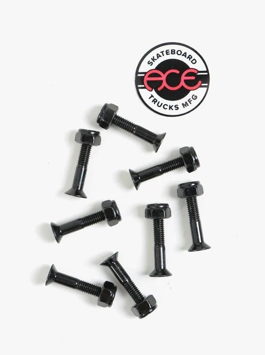 Skateboard truck mounting bolts with an Ace Trucks logo.