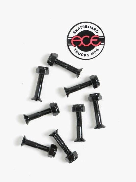 Skateboard truck mounting bolts with an Ace Trucks logo sticker.