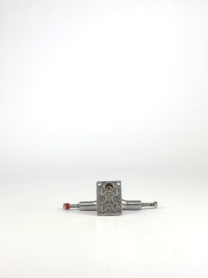 Metal valve or regulator with inlet and outlet ports.
