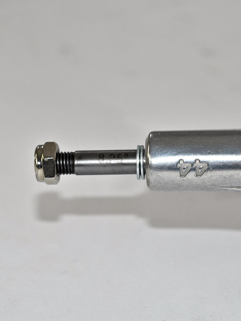 Metallic cylindrical object with a protruding bolt or screw at one end.