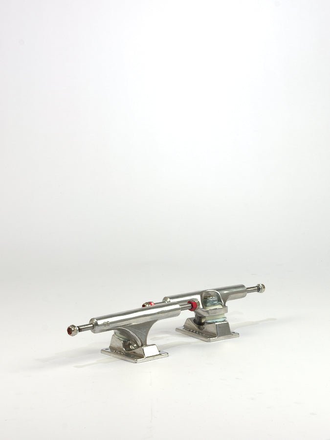 Pair of Ace Trucks AF1 Low Profile Skateboard Trucks with silver finish and red bushings