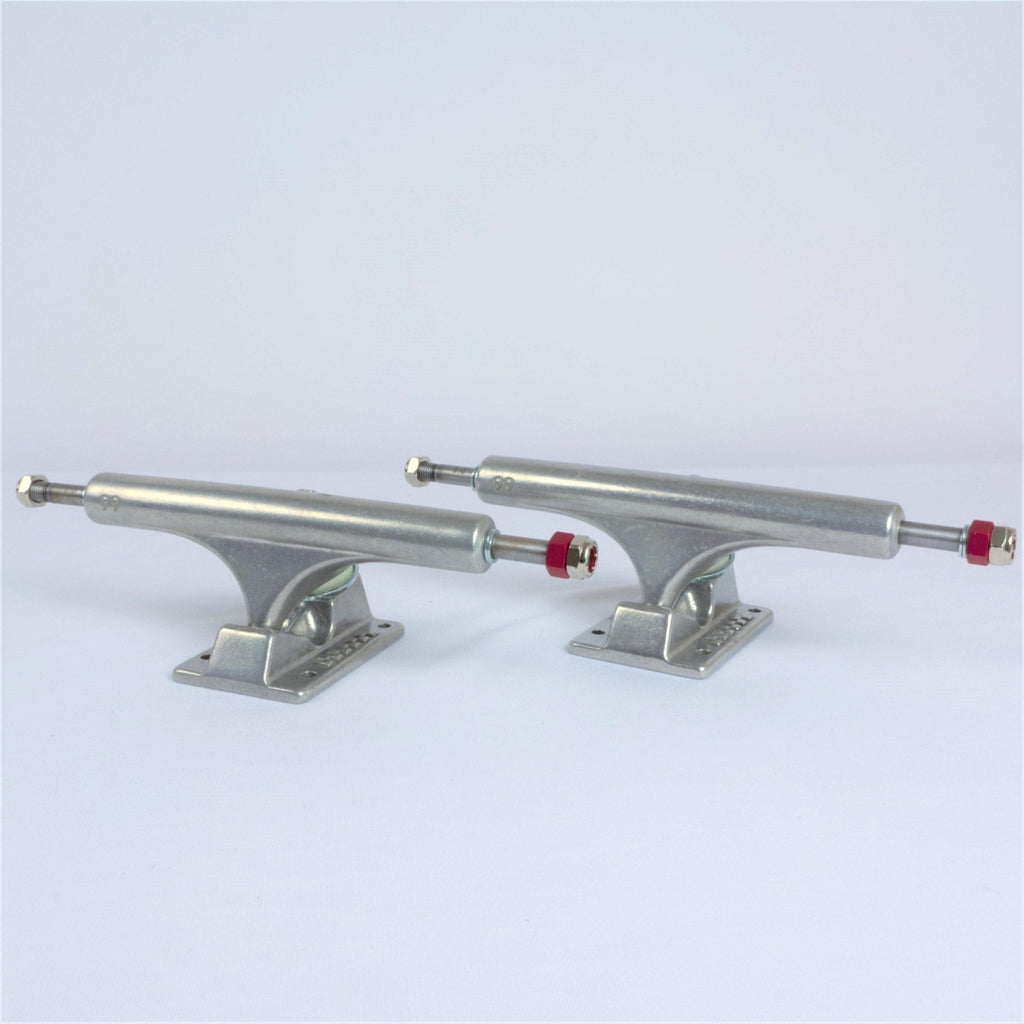 Pair of Ace Trucks skateboard trucks with silver finish and red bushings for optimal performance