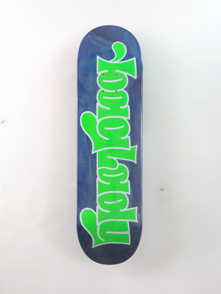 Skateboard deck with bright green ’Mayhem’ text on a dark blue background.