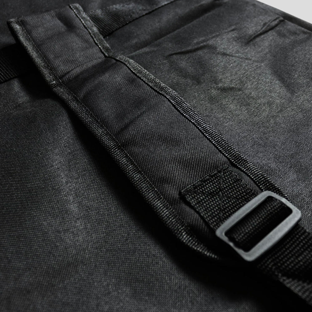 Black fabric strap with a plastic buckle attached.