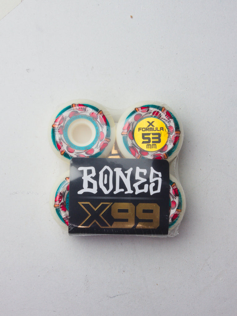 Set of skateboard wheels with ’BONES’ and ’X99’’ branding featuring colorful geometric patterns.