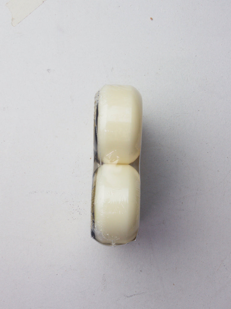 Two white cylindrical tablets stacked on top of each other.