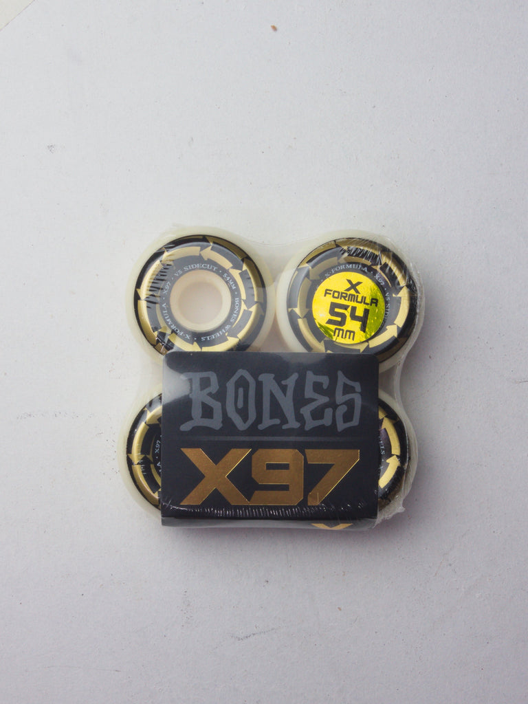 Set of four black Bones X97 skateboard wheels.