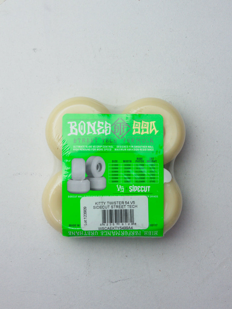 Pack of four white skateboard wheels with neon green packaging.