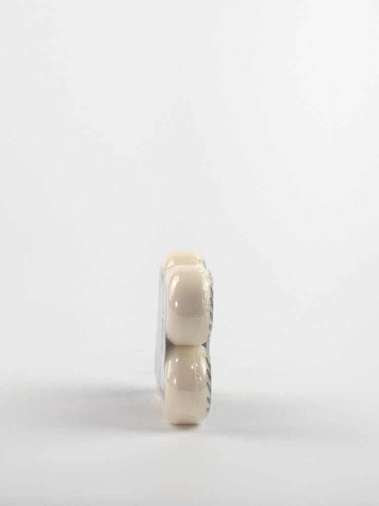Two white pills or tablets stacked vertically.