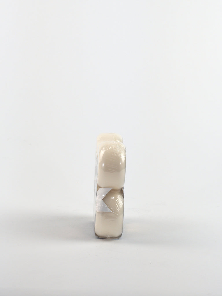 Broken white pill standing on edge beside Bones Wheels X99 Formula Machine V5 Sidecut