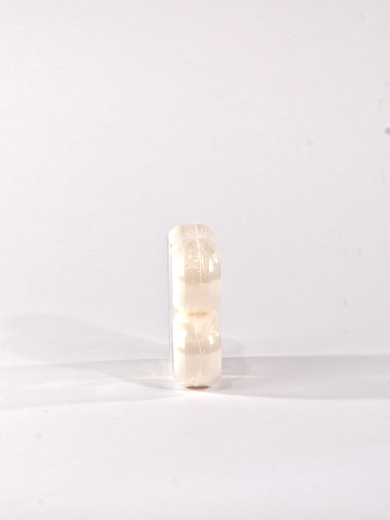 Translucent cylindrical object with a slight yellowish tint.