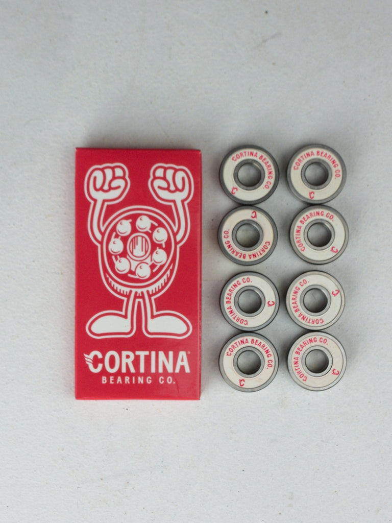 Set of skateboard bearings with a red Cortina Bearing Co. logo card.