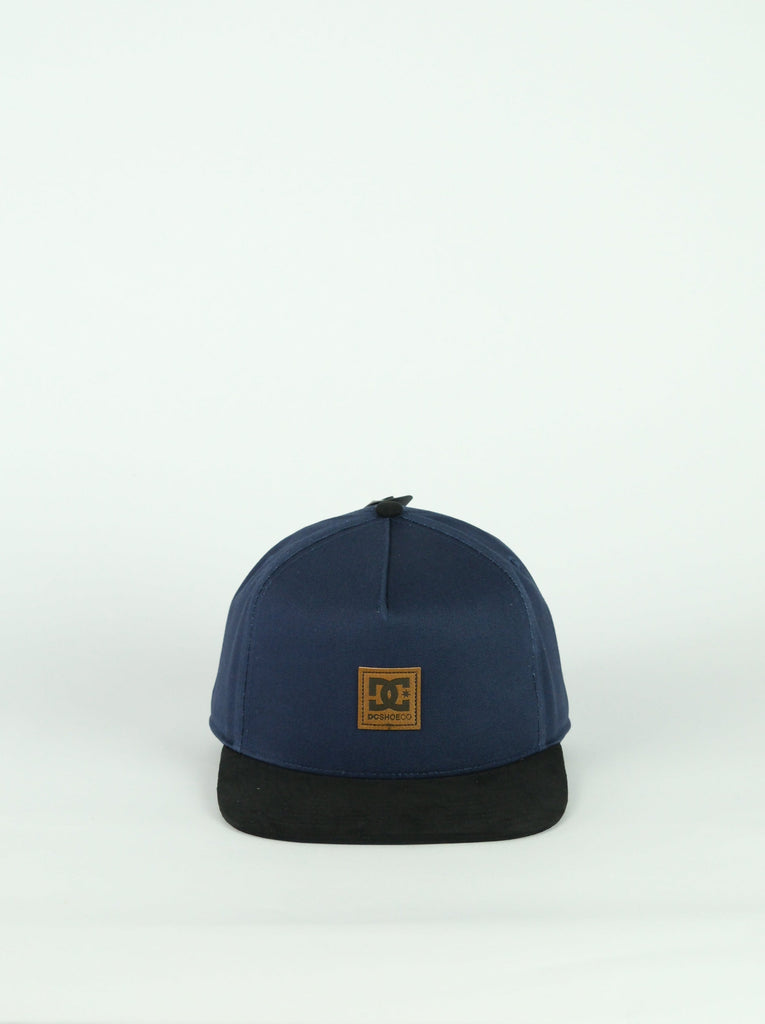 Navy blue and black snapback cap with DC logo patch, perfect for navy blue shoes cut