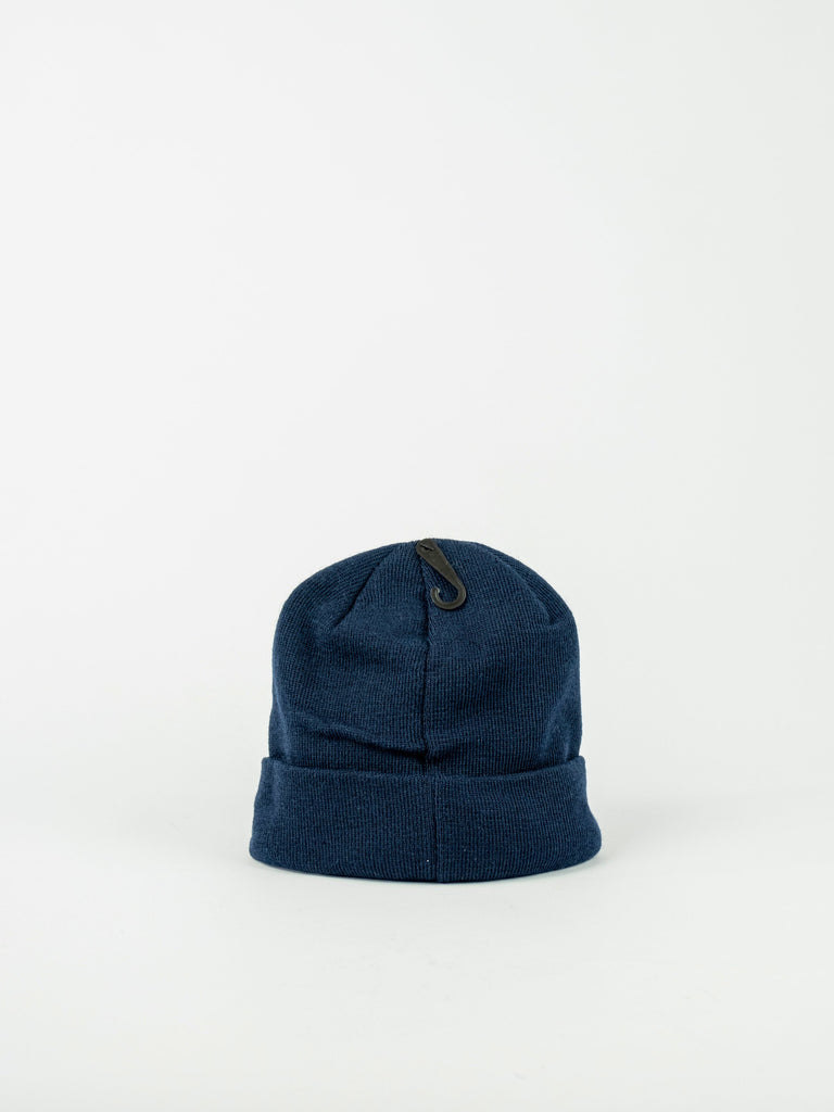 Navy blue knit Frontline Beanie with folded brim and tag, part of DC Shoes collection