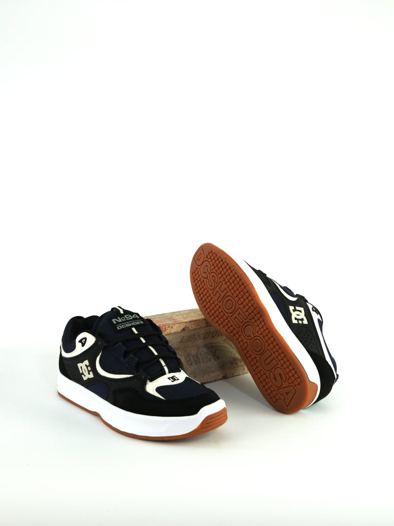 Pair of black and white DC Shoes Kalynx Zero with gum soles for skateboarding, black blue skate