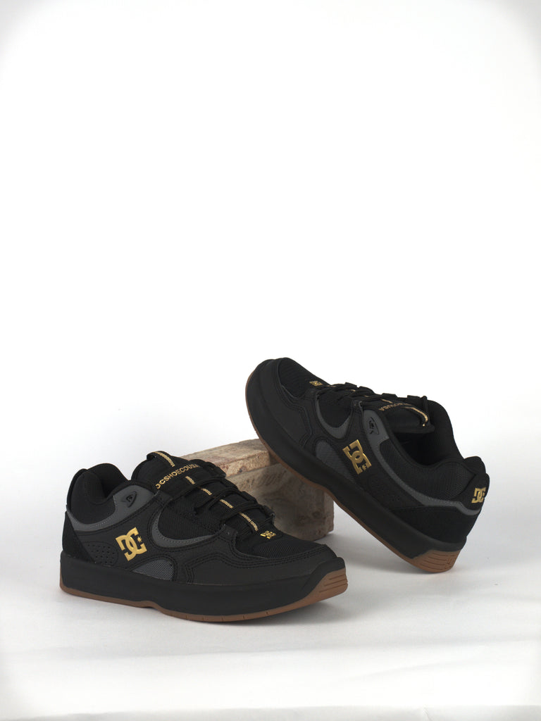 Stylish Black Dc Kalynx Zero Skate Shoes With Gold Accents And Gum Soles