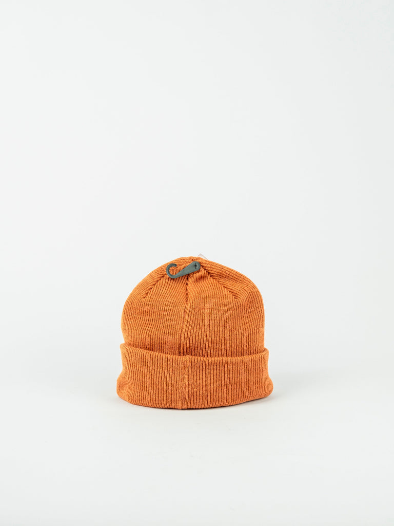 Orange knit Label Beanie by Dc Shoes with green leaf embellishment on top