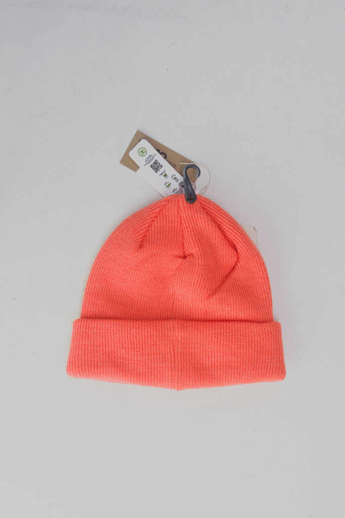 Bright coral-colored ribbed knit beanie with a folded cuff.