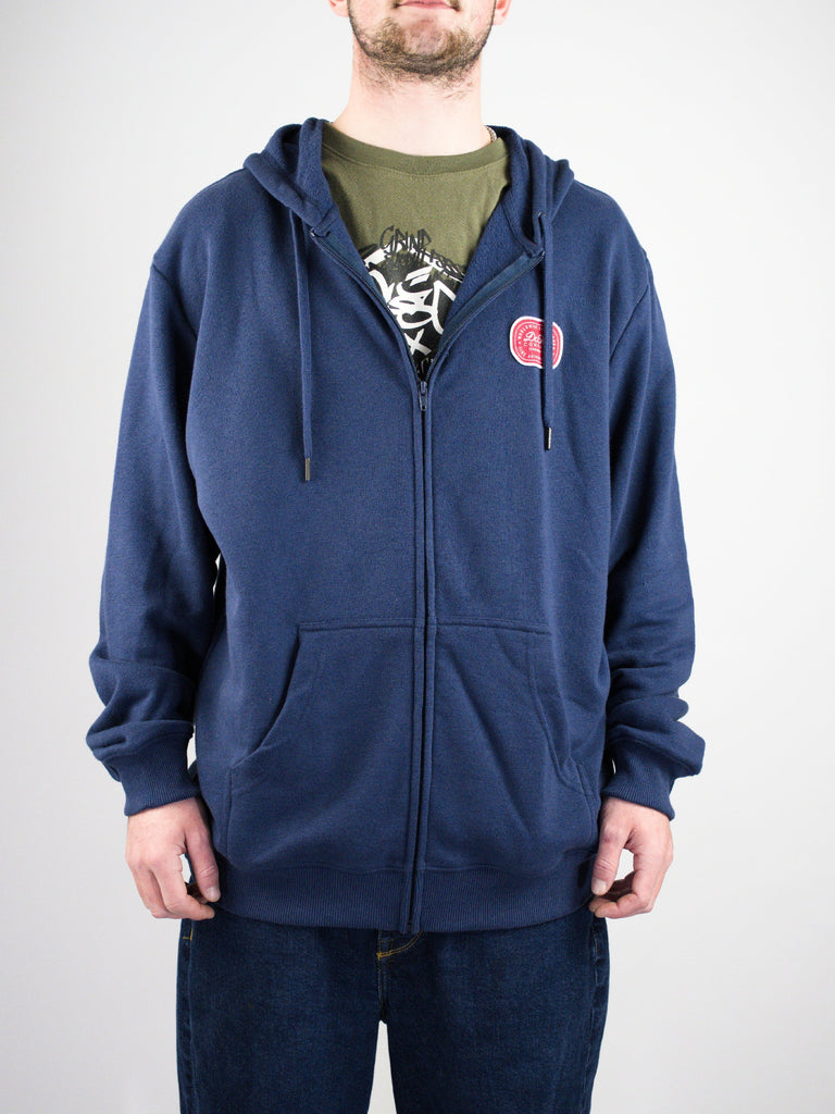 Navy blue zip-up hoodie with a small circular logo patch.