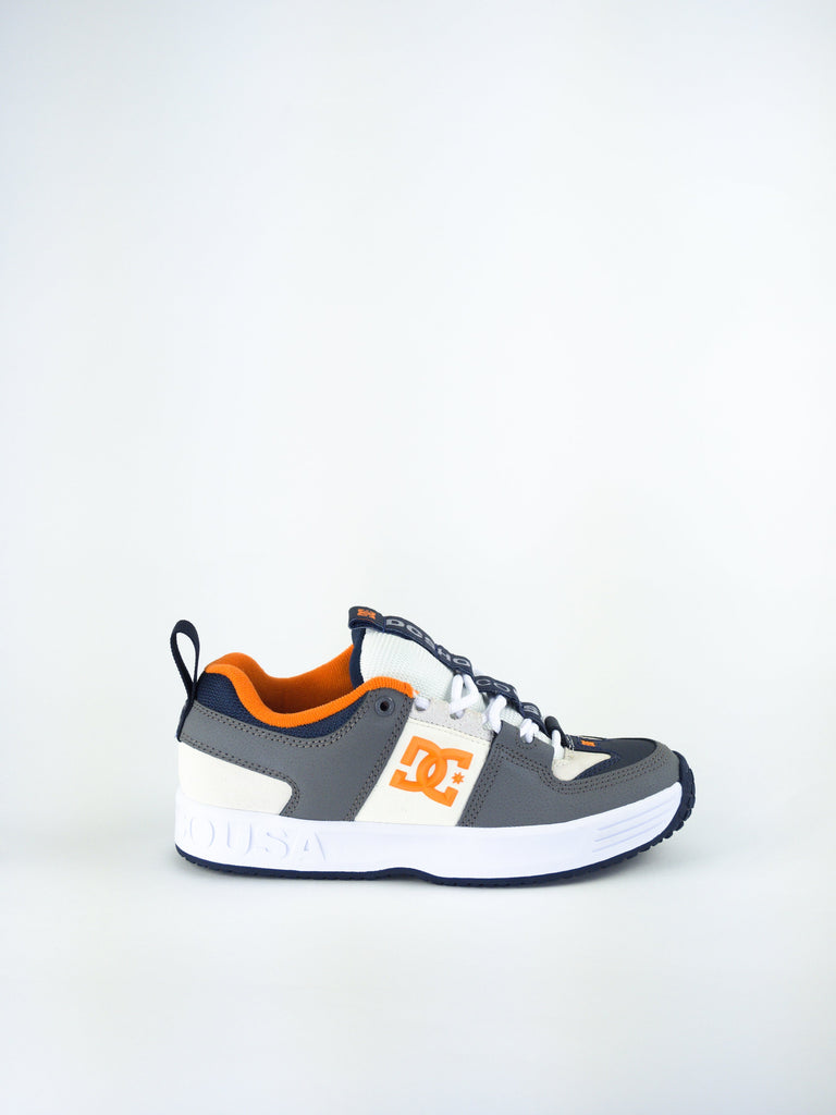 DC athletic sneaker in grey, white and orange colors.