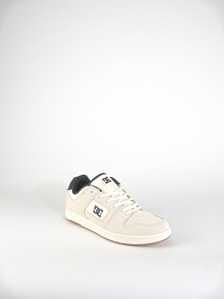 White DC Shoes Manteca 4 footwear with black accents for online skateboard enthusiasts